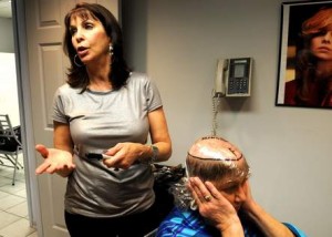 suntimes51421_4-Linda-Leinweber-owner-of-Shears-To-You-Salon-demonstrates-technique-of-hair-replacement.-Larry-RuehlSun-Times-Media-300x214
